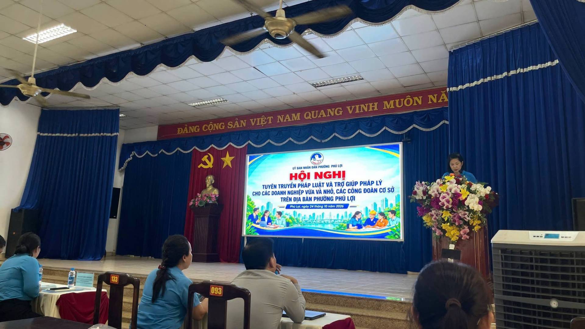 May be an image of speaker, dais and text