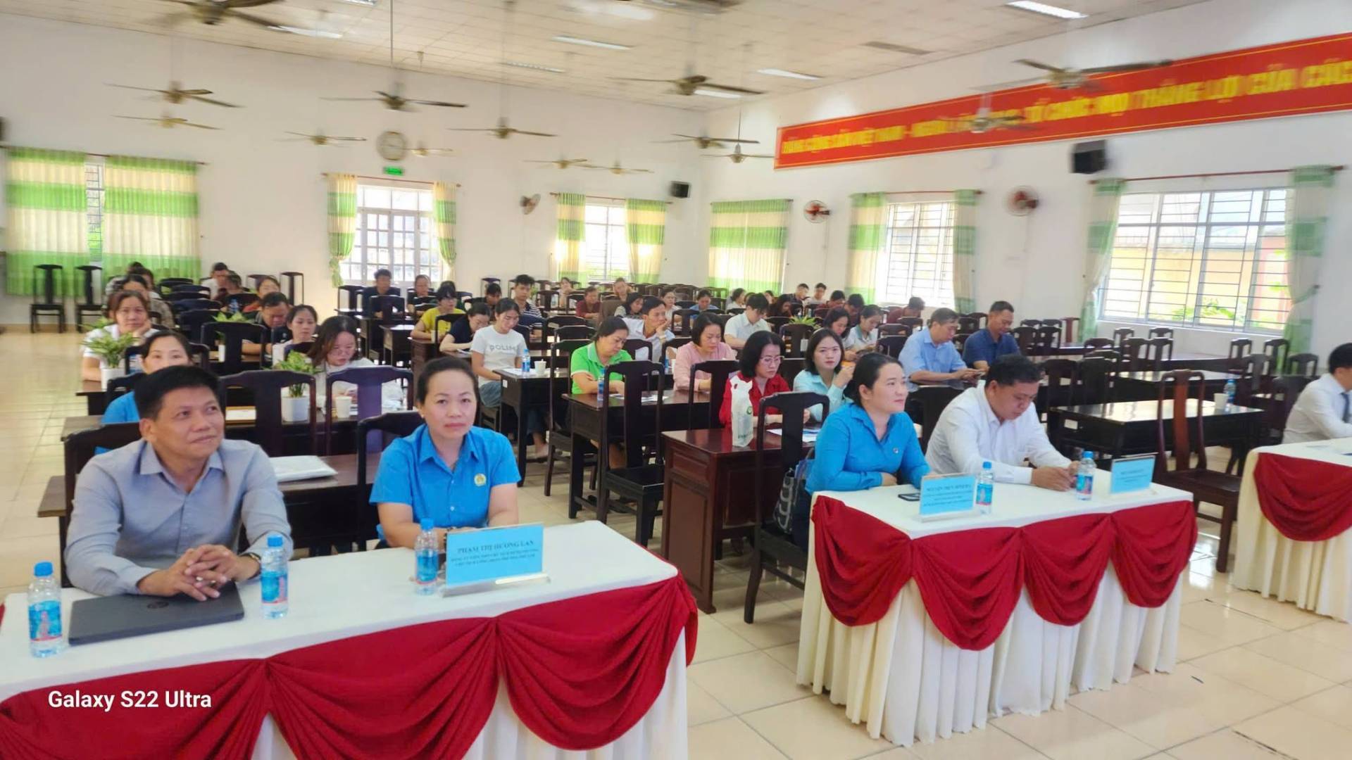 May be an image of one or more people, people studying, table and text