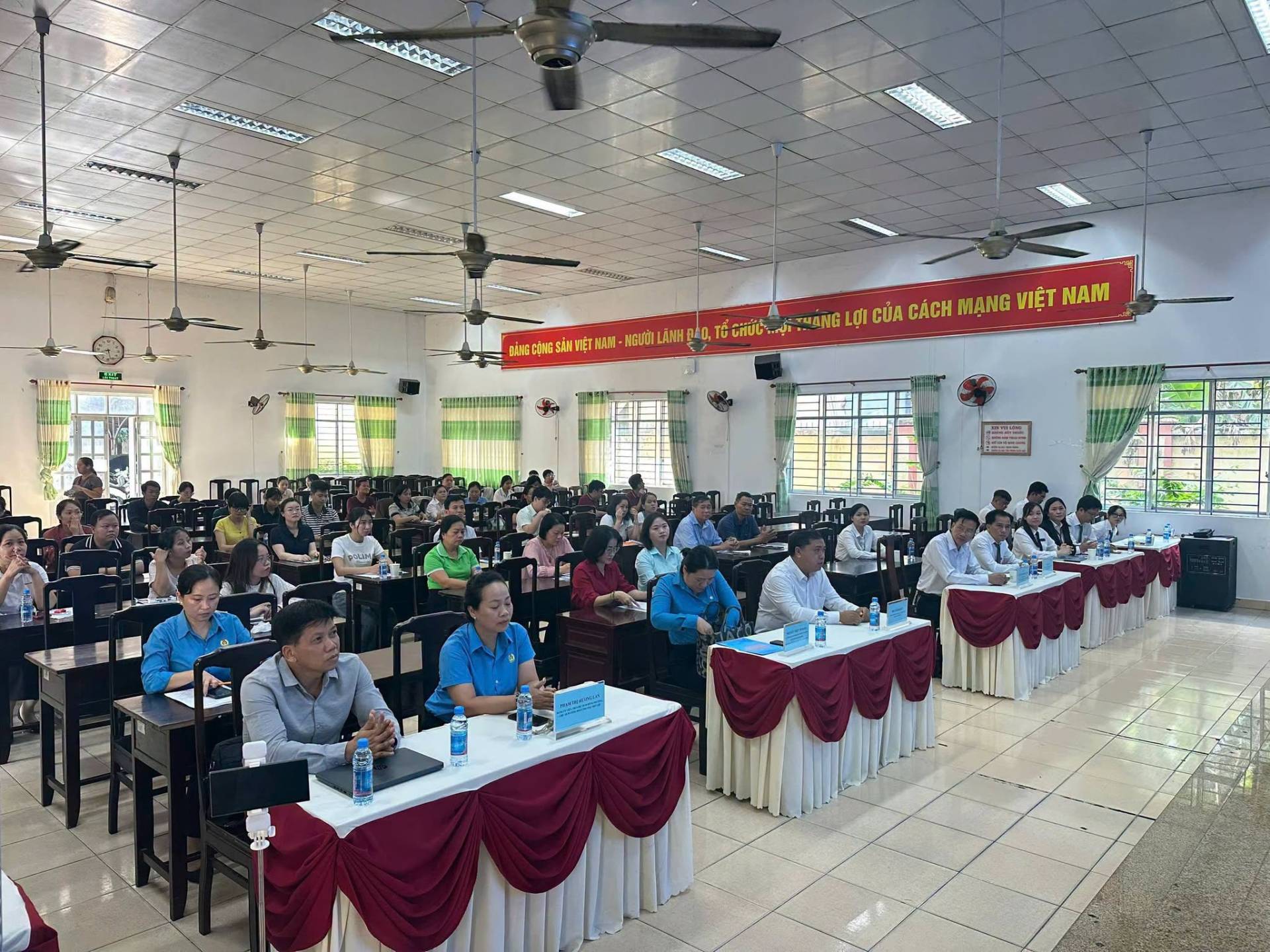May be an image of one or more people, people studying, table and text